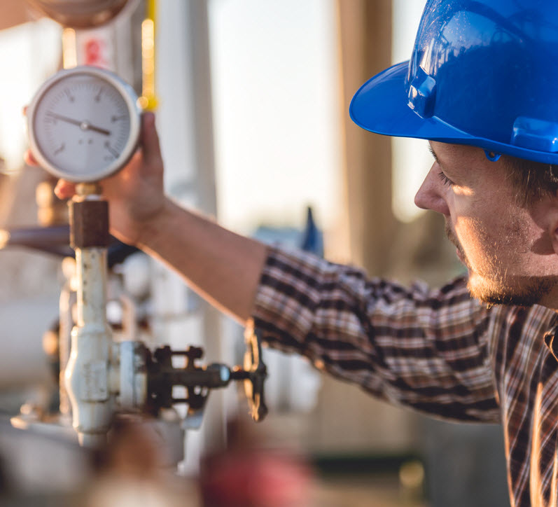 technician checking manometer